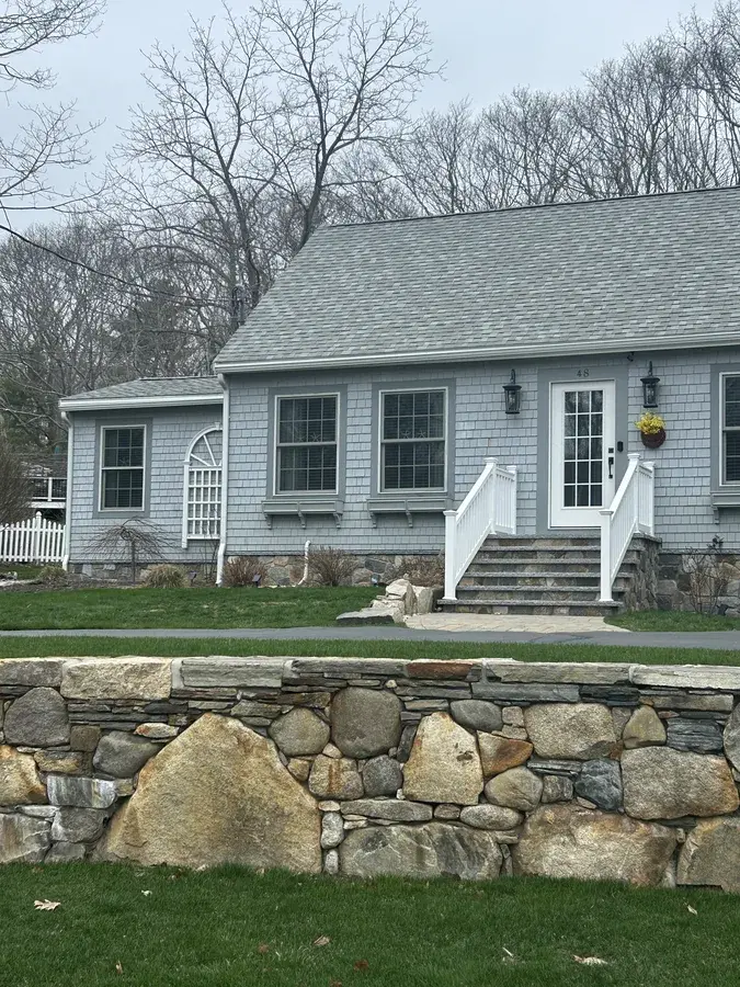 Sparkling windows on a gray shingle home in Kennebunk