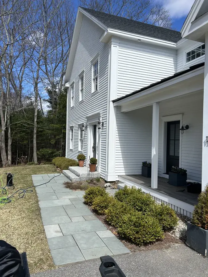 Freshly cleaned windows on a white clapboard home