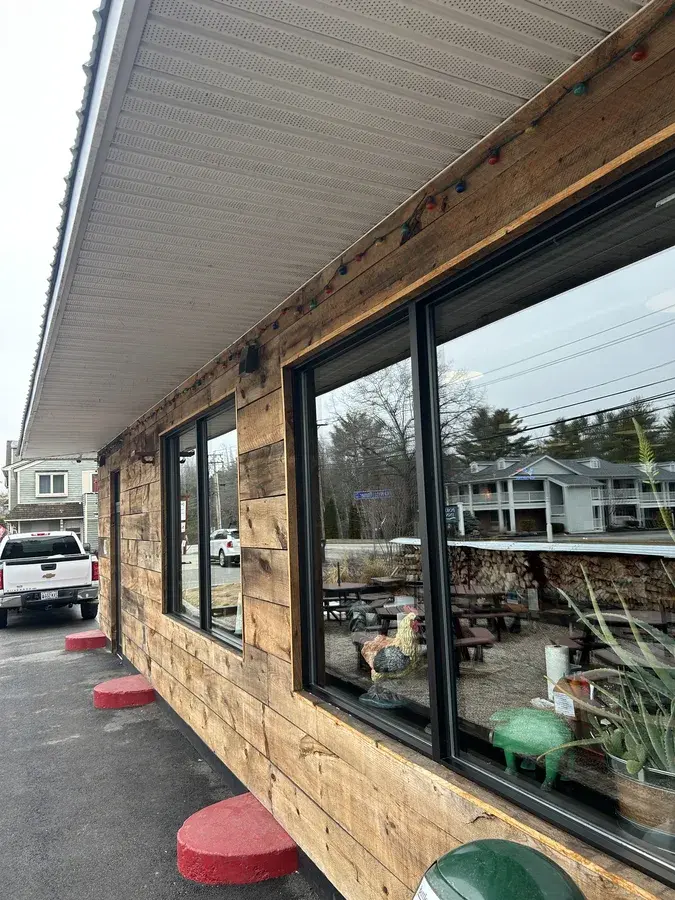 Detailed arched window cleaning on a custom home